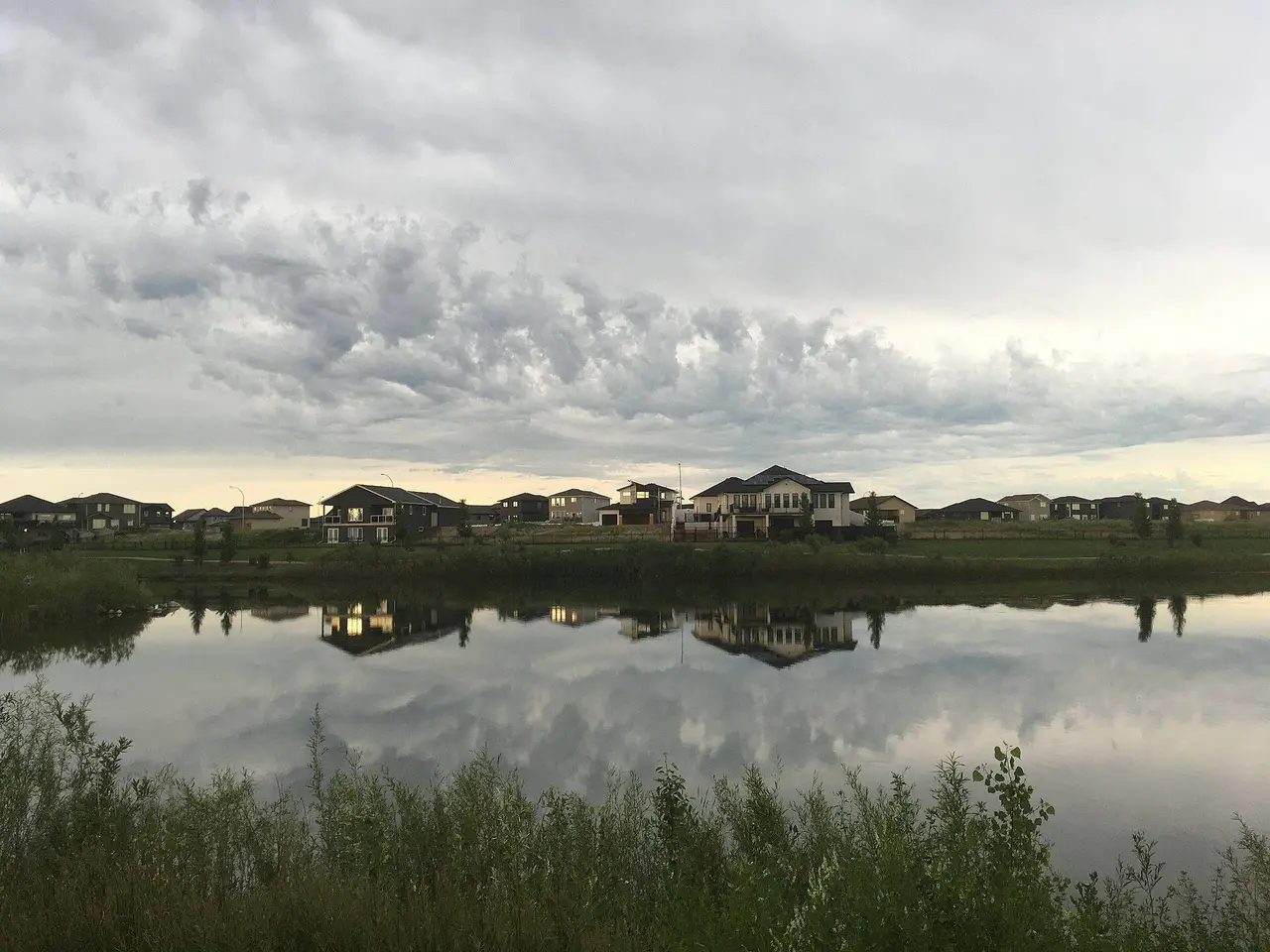 Houses across the lake in Pilot Butte, 2020